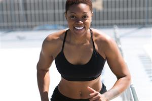 Fit woman runs up steps